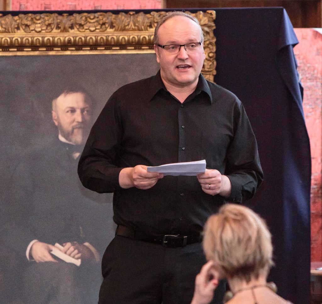 Ian Hammond Brown, writer of Carnegie the Star Spangled Scotchman, talks about the show at the launch at the Dunfermline Carnegie Library & Galleries with the Carnegie portrait behind him.